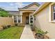 Front entry with walkway, landscaping, and columns at 13141 Palmilla Cir, Dade City, FL 33525