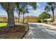 House exterior showcasing a tan garage, stone accents, and landscaping at 13141 Palmilla Cir, Dade City, FL 33525