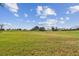 Spacious green golf course with homes in the background at 13141 Palmilla Cir, Dade City, FL 33525