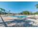 Community pool with a pool house and surrounding patio at 13141 Palmilla Cir, Dade City, FL 33525