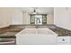Kitchen features a large farmhouse sink and granite countertops at 13141 Palmilla Cir, Dade City, FL 33525