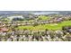 Aerial view of homes near golf course and lake at 13141 Palmilla Cir, Dade City, FL 33525