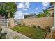 Landscaped side yard with a gate and pathway at 13141 Palmilla Cir, Dade City, FL 33525