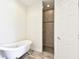 Bathroom features a shower and a clawfoot tub at 13141 Palmilla Cir, Dade City, FL 33525