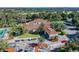 Clubhouse with red tile roof and golf course view at 13141 Palmilla Cir, Dade City, FL 33525