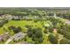 Aerial view of community park with tennis and basketball courts at 13141 Palmilla Cir, Dade City, FL 33525