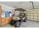 Garage with golf cart and storage cabinets at 13141 Palmilla Cir, Dade City, FL 33525