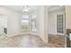 Eat-in kitchen with wood-look floors and ample natural light at 13141 Palmilla Cir, Dade City, FL 33525