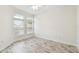 Spacious bedroom with hardwood floors and large windows at 13141 Palmilla Cir, Dade City, FL 33525