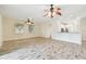 Open living room with lots of natural light and ceiling fans at 13141 Palmilla Cir, Dade City, FL 33525