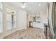 Bright kitchen featuring white cabinets and a farmhouse sink at 13141 Palmilla Cir, Dade City, FL 33525