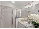 Clean bathroom with a walk-in shower and modern vanity at 13229 Golf Ridge Pl, Hudson, FL 34669