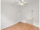 Light and airy bedroom with wood floors and access to other rooms at 13229 Golf Ridge Pl, Hudson, FL 34669