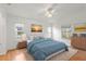 Spacious bedroom with wood floors and ceiling fan at 13229 Golf Ridge Pl, Hudson, FL 34669