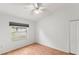 Bright bedroom with wood floors and ceiling fan at 13229 Golf Ridge Pl, Hudson, FL 34669