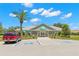 Community clubhouse with parking and landscaping at 13229 Golf Ridge Pl, Hudson, FL 34669