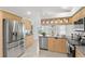 Spacious kitchen with stainless steel appliances and island at 13229 Golf Ridge Pl, Hudson, FL 34669
