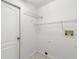 Laundry room with shelving and hookups for washer and dryer at 13229 Golf Ridge Pl, Hudson, FL 34669