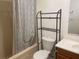 Clean bathroom with shower/tub and wood vanity at 1601 Berwick Ct # B, Palm Harbor, FL 34684