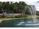 Highland Lakes community entrance with fountain at 1601 Berwick Ct # B, Palm Harbor, FL 34684