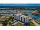 Aerial view of waterfront condo building and canal at 19029 Us Highway 19 N # 9-706, Clearwater, FL 33764