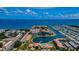 Aerial view of waterfront community with pool, dock, and marina at 19029 Us Highway 19 N # 9-706, Clearwater, FL 33764