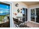 Balcony with glass-top table and chairs at 19029 Us Highway 19 N # 9-706, Clearwater, FL 33764