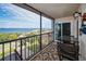Spacious balcony with water views and seating for two at 19029 Us Highway 19 N # 9-706, Clearwater, FL 33764