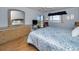 Bedroom with king-size bed and dresser, plus water views at 19029 Us Highway 19 N # 9-706, Clearwater, FL 33764