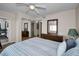 Bedroom with mirrored closet and dresser at 19029 Us Highway 19 N # 9-706, Clearwater, FL 33764