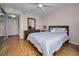 Bright bedroom with striped bedding and water view at 19029 Us Highway 19 N # 9-706, Clearwater, FL 33764