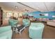 Relaxing common room with seating and library at 19029 Us Highway 19 N # 9-706, Clearwater, FL 33764