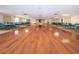 Bright community room with hardwood floors and a stage at 19029 Us Highway 19 N # 9-706, Clearwater, FL 33764