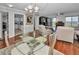 Dining area with glass table and view of living room and kitchen at 19029 Us Highway 19 N # 9-706, Clearwater, FL 33764