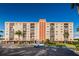 Condo building with parking and landscaping at 19029 Us Highway 19 N # 9-706, Clearwater, FL 33764