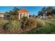 Gated entrance with guard house and landscaping at 19029 Us Highway 19 N # 9-706, Clearwater, FL 33764