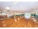 Large community room with hardwood floors and tables at 19029 Us Highway 19 N # 9-706, Clearwater, FL 33764