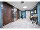 Condo lobby with elevators and a seating area at 19029 Us Highway 19 N # 9-706, Clearwater, FL 33764
