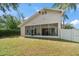 Backyard view of house showing large screened porch at 2429 Dana Dr, Safety Harbor, FL 34695