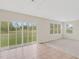 Bright living room with sliding glass doors leading to backyard at 30619 White Bird Ave, Wesley Chapel, FL 33543