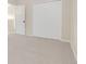 Bedroom featuring neutral walls, carpeting, and double door closet at 30619 White Bird Ave, Wesley Chapel, FL 33543