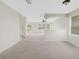 Spacious living room with neutral carpeting and high ceilings at 30619 White Bird Ave, Wesley Chapel, FL 33543