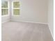 Bright bedroom with neutral walls, carpeting, and window with blinds at 30619 White Bird Ave, Wesley Chapel, FL 33543