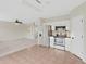 Open kitchen features stainless steel appliances and view into living room at 30619 White Bird Ave, Wesley Chapel, FL 33543