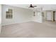 Open living area with kitchen and stairs at 30619 White Bird Ave, Wesley Chapel, FL 33543
