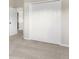 Bedroom with neutral walls, carpeting, and double door closet at 30619 White Bird Ave, Wesley Chapel, FL 33543