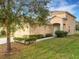 Two-story house with attached garage and landscaping at 30619 White Bird Ave, Wesley Chapel, FL 33543