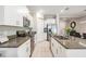 Modern kitchen with white cabinets and granite countertops at 32013 Blue Passing Loop, Wesley Chapel, FL 33545