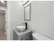 Bright bathroom features a vessel sink, modern fixtures, and an updated mirror at 3414 Lindsey St, Dover, FL 33527