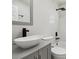New bathroom features white tile, matte black fixtures, and vessel sink at 3414 Lindsey St, Dover, FL 33527